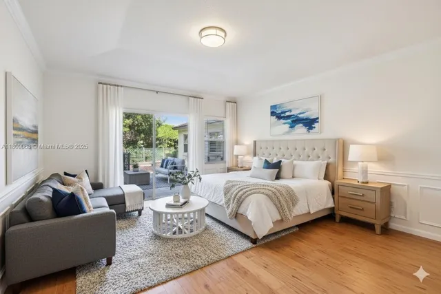 a spacious bedroom with a bed and a couch