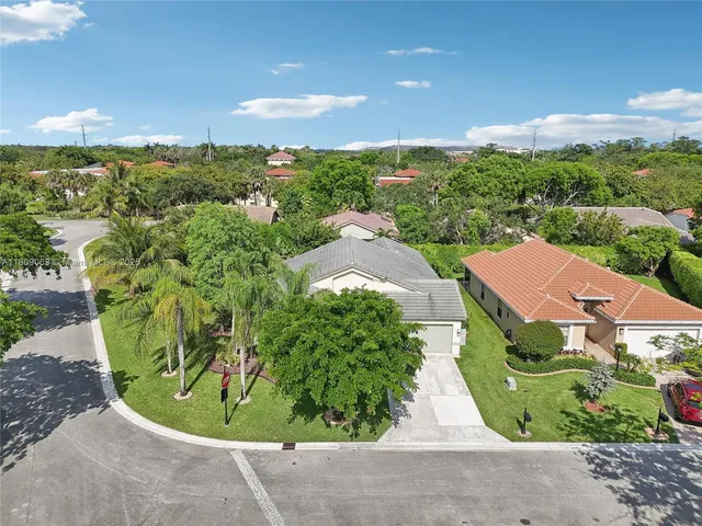 a view of a swimming pool with a yard