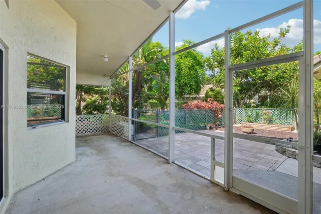 a view of a house with porch and garden