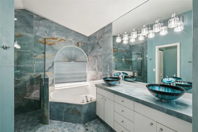 a bathroom with a sink double vanity and a mirror