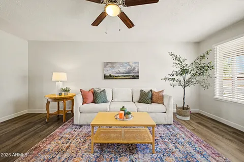 a living room with furniture and a window