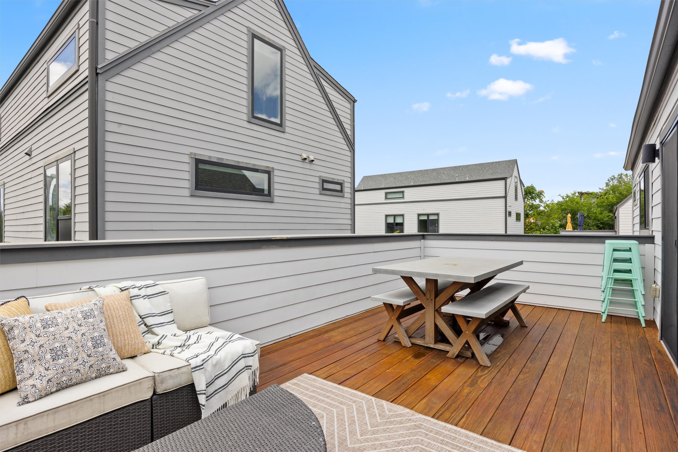 1116 Stobaugh Street, Unit B Austin, TX 78757 - Photo 28 of 38 Wood decking and privacy walls create a comfortable extension of the primary suite.
