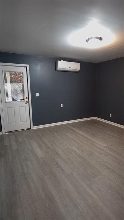 3171 Redwood Run Atlanta, GA 30349 - Photo 2 of 7 an empty room with wooden floor and windows