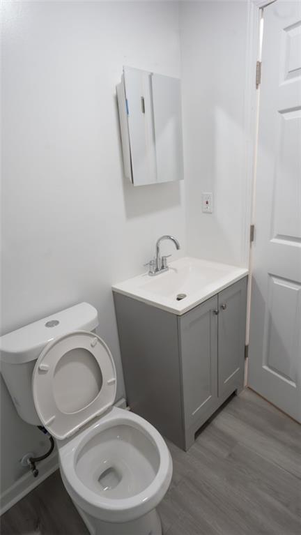 3171 Redwood Run Atlanta, GA 30349 - Photo 7 of 7 a white toilet sitting next to a bathroom sink