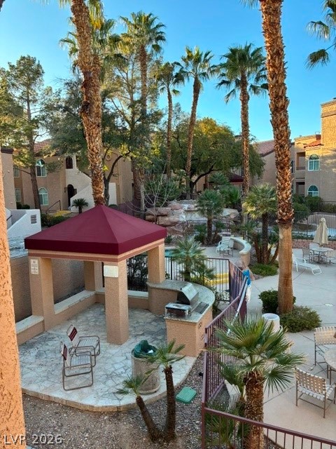 9325 West Desert Inn Road, Unit 244 Las Vegas, NV 89117 - Photo 38 of 55 Lush landscaping and outdoor grilling areas define this vibrant community space.