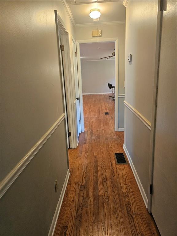 2107 Flat Shoals Road Southwest Conyers, GA 30094 - Photo 11 of 21 a view of a hallway with wooden floor and staircase