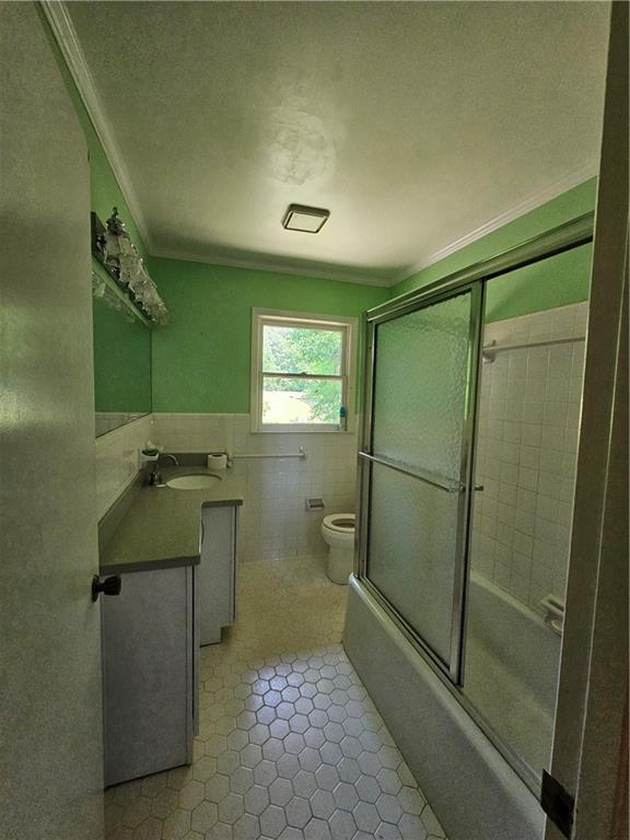 2107 Flat Shoals Road Southwest Conyers, GA 30094 - Photo 12 of 21 a bathroom with a sink a toilet and shower