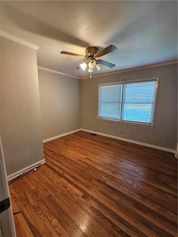 2107 Flat Shoals Road Southwest Conyers, GA 30094 - Photo 13 of 21 a view of empty room with wooden floor and fan