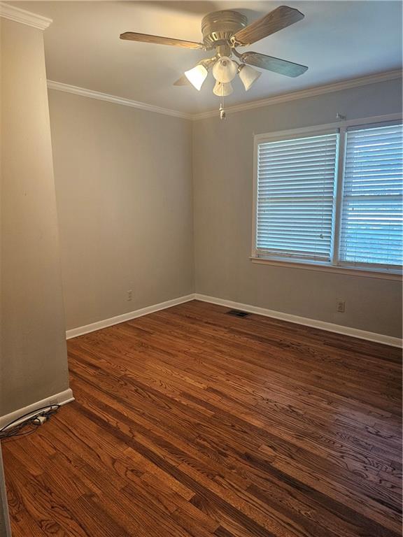 2107 Flat Shoals Road Southwest Conyers, GA 30094 - Photo 14 of 21 a view of empty room with wooden floor and fan