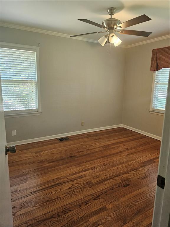 2107 Flat Shoals Road Southwest Conyers, GA 30094 - Photo 15 of 21 wooden floor in an empty room with a window