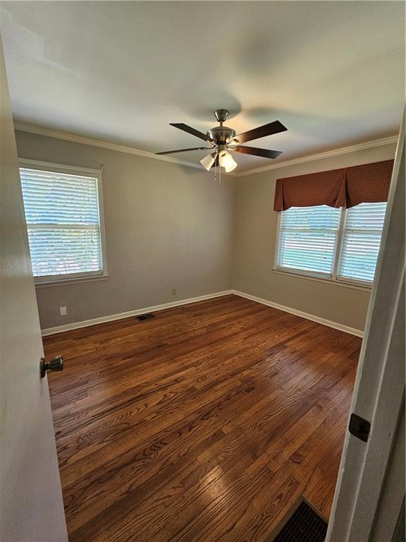 2107 Flat Shoals Road Southwest Conyers, GA 30094 - Photo 17 of 21 wooden floor in an empty room with a window