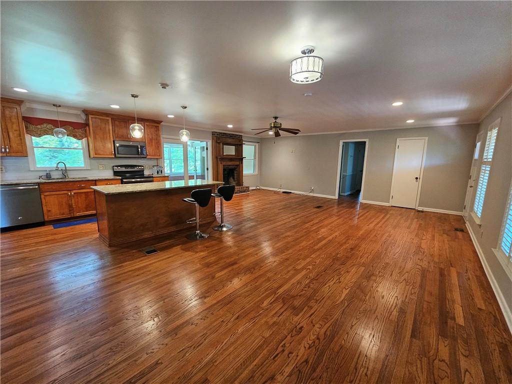 2107 Flat Shoals Road Southwest Conyers, GA 30094 - Photo 3 of 21 a view of kitchen and sink with wooden floor