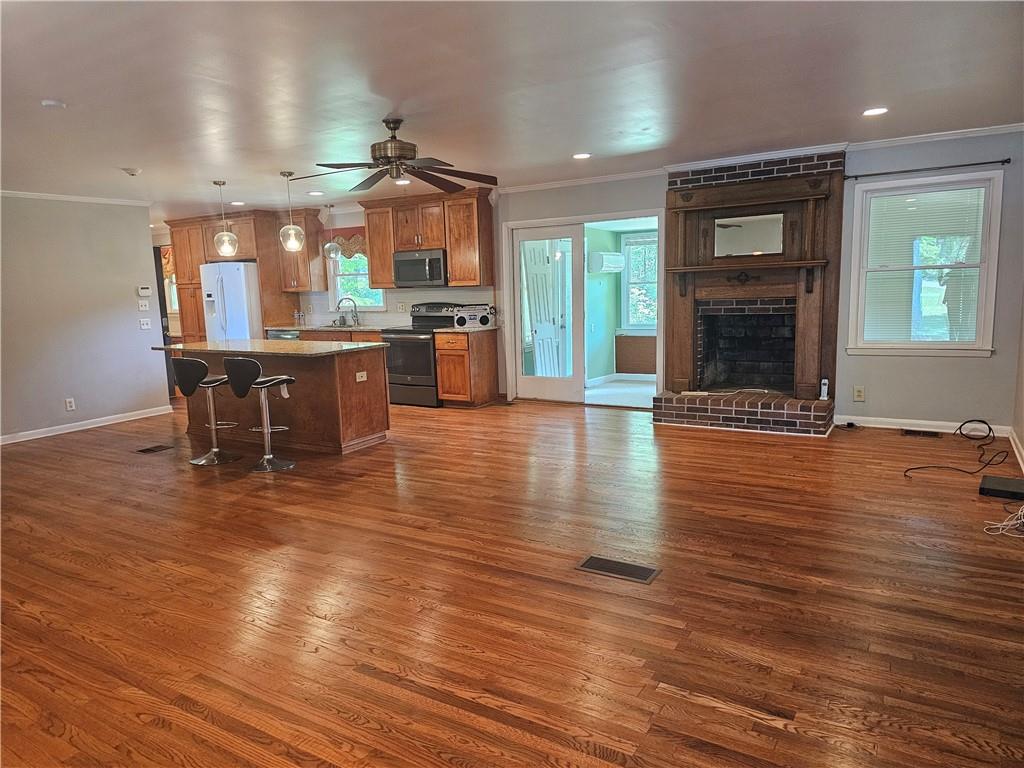 2107 Flat Shoals Road Southwest Conyers, GA 30094 - Photo 6 of 21 a view of a room with kitchen and dining room