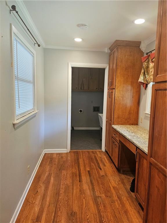 2107 Flat Shoals Road Southwest Conyers, GA 30094 - Photo 10 of 21 a view of a kitchen with wooden floor and electronic appliances