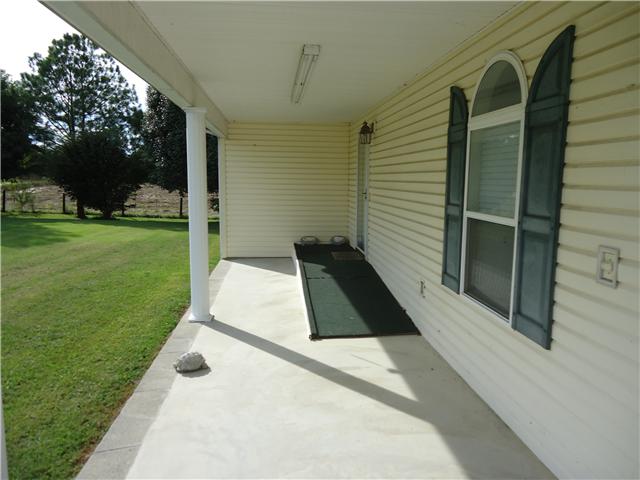 1850 Riddle Road Manchester, TN 37355 - Photo 4 of 10 The covered front porch has a hanicap ramp that can easily be removed or left in place.
