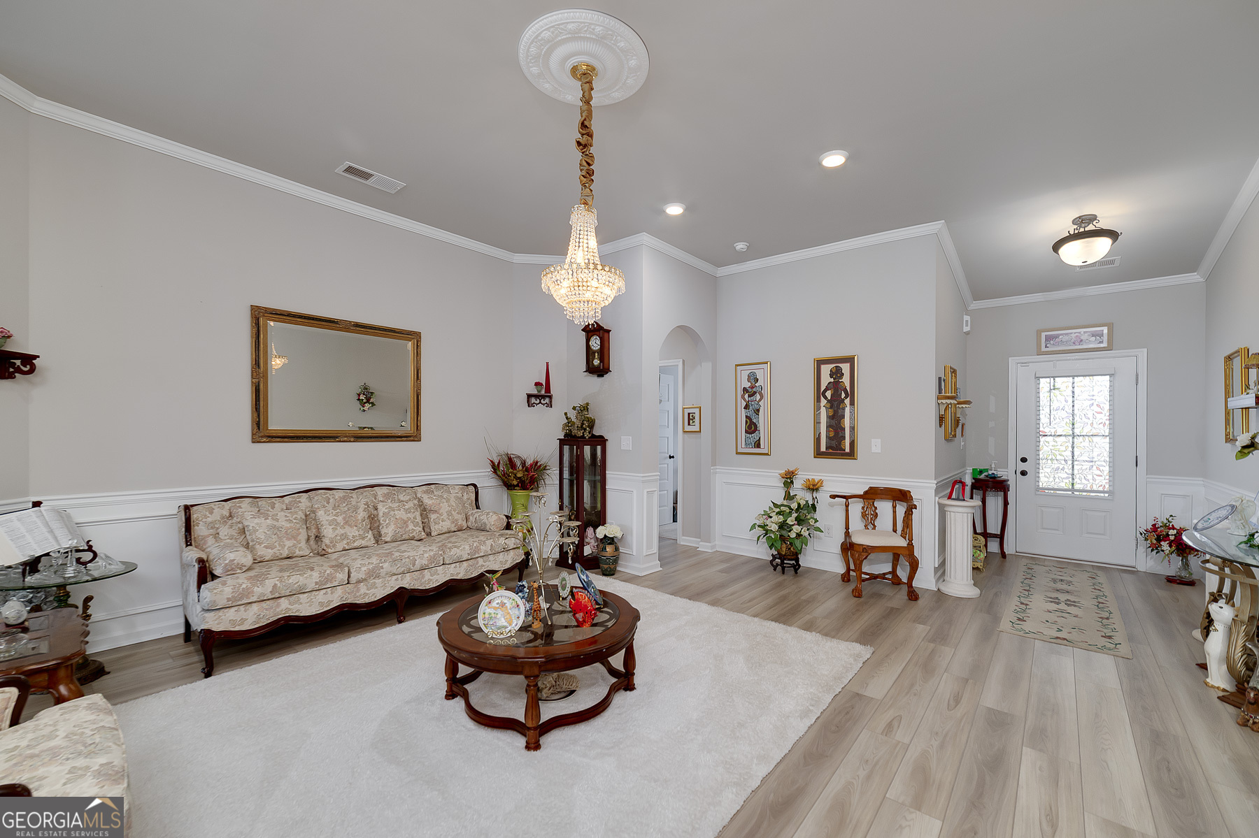 1517 Stinson Lane, Unit PHASE Locust Grove, GA 30248 - Photo 11 of 46 a living room with furniture and wooden floor