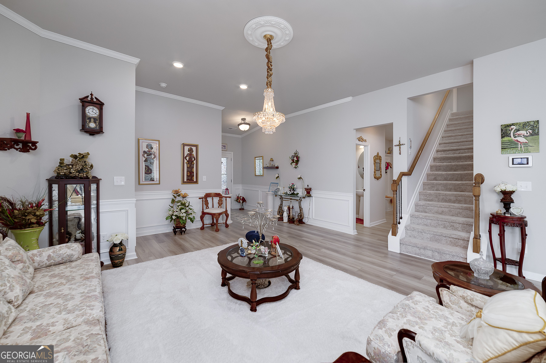 1517 Stinson Lane, Unit PHASE Locust Grove, GA 30248 - Photo 12 of 46 a living room with furniture and wooden floor