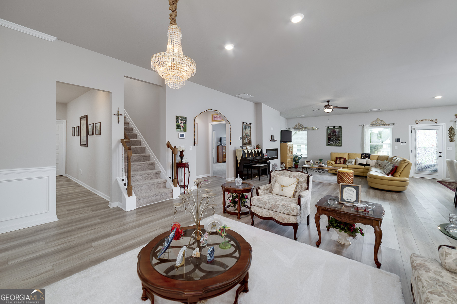 1517 Stinson Lane, Unit PHASE Locust Grove, GA 30248 - Photo 13 of 46 a living room with furniture and a wooden floor