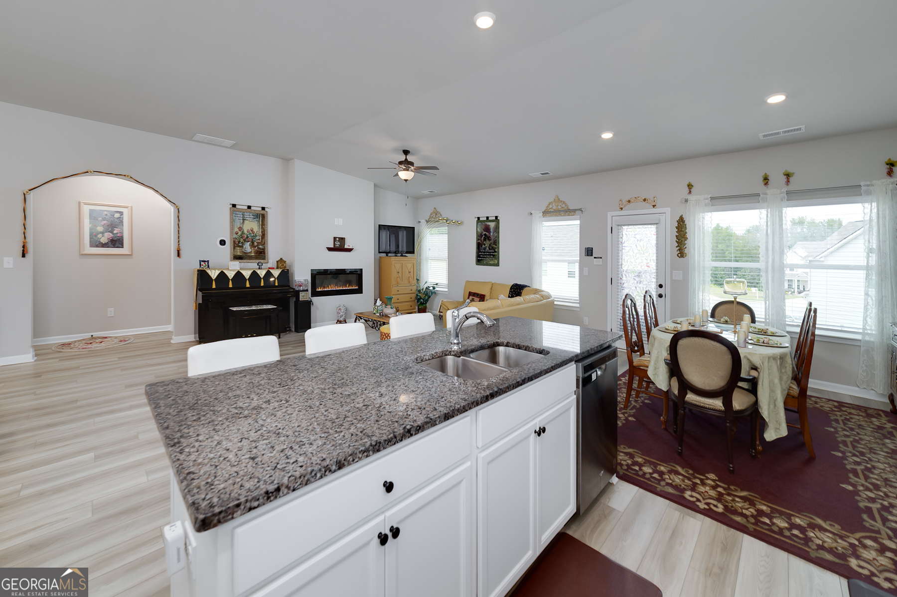 1517 Stinson Lane, Unit PHASE Locust Grove, GA 30248 - Photo 19 of 46 a kitchen with granite countertop sink and cabinets