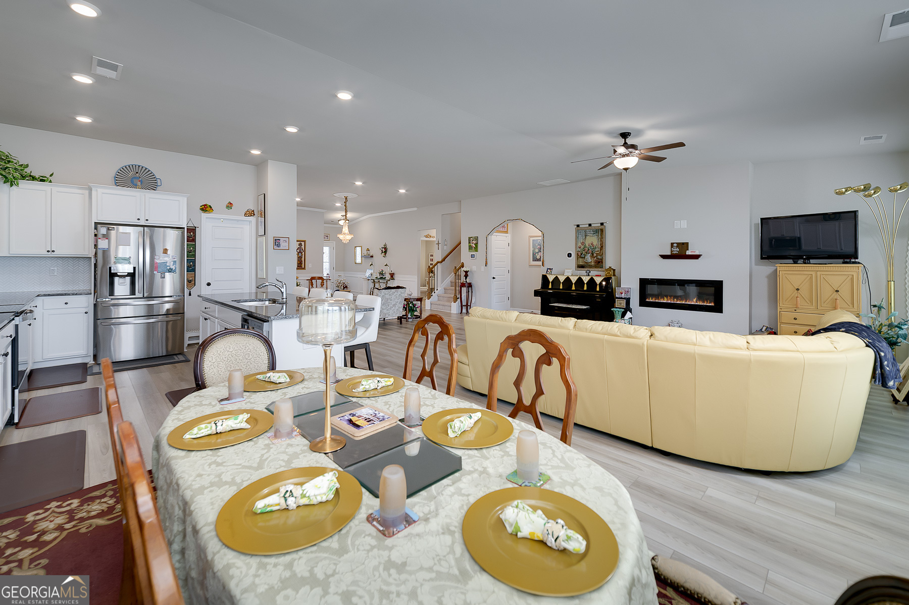 1517 Stinson Lane, Unit PHASE Locust Grove, GA 30248 - Photo 21 of 46 a living room with furniture and a wooden floor
