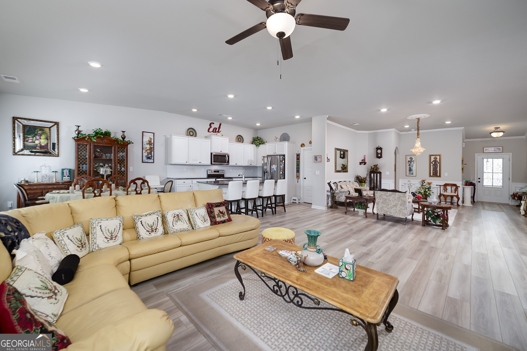 1517 Stinson Lane, Unit PHASE Locust Grove, GA 30248 - Photo 24 of 46 a living room with furniture and kitchen view
