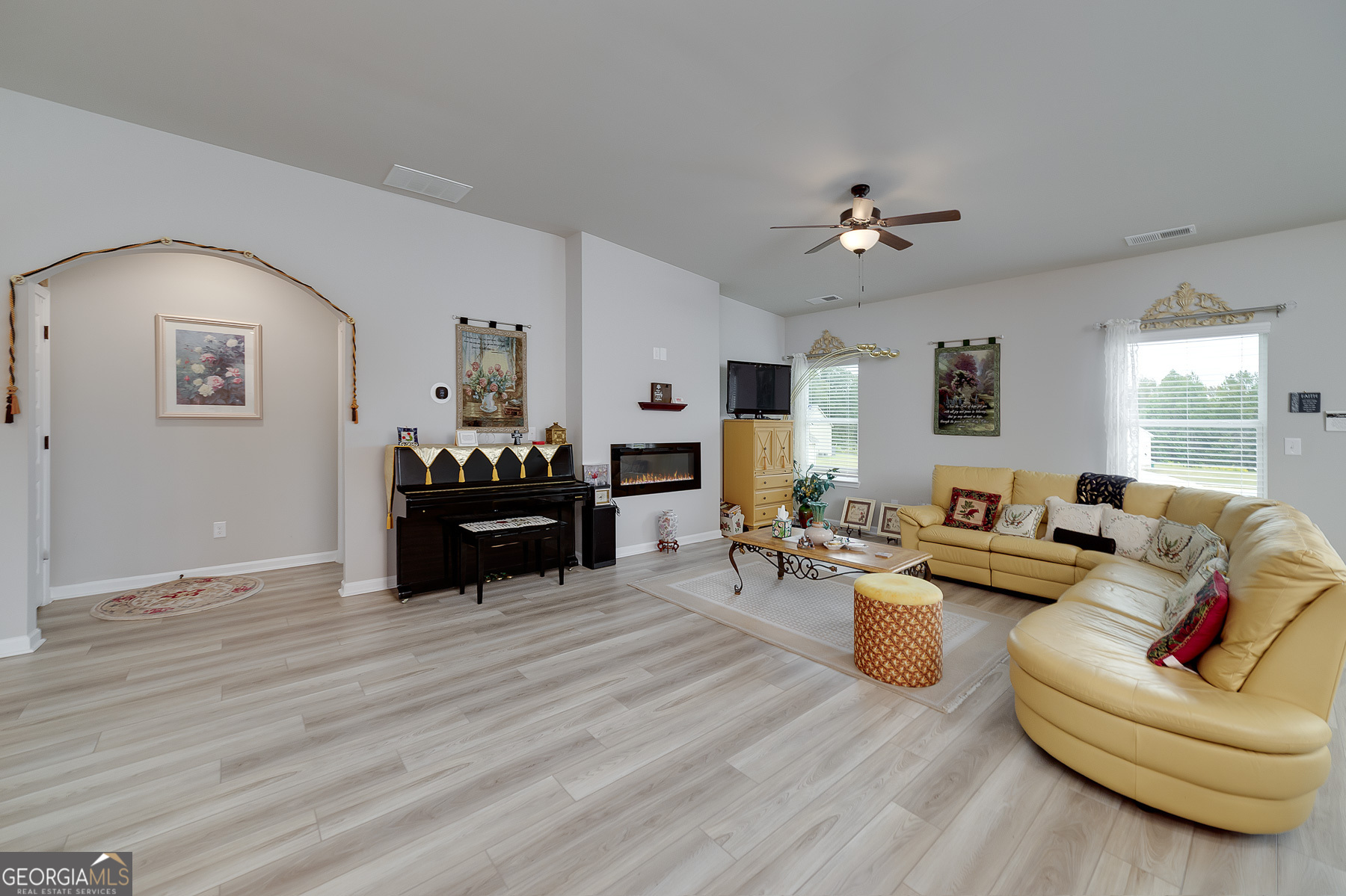 1517 Stinson Lane, Unit PHASE Locust Grove, GA 30248 - Photo 25 of 46 a living room with furniture and a fireplace