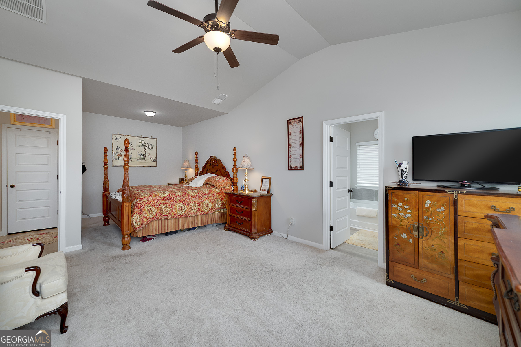 1517 Stinson Lane, Unit PHASE Locust Grove, GA 30248 - Photo 27 of 46 a bedroom with a bed and flat screen tv