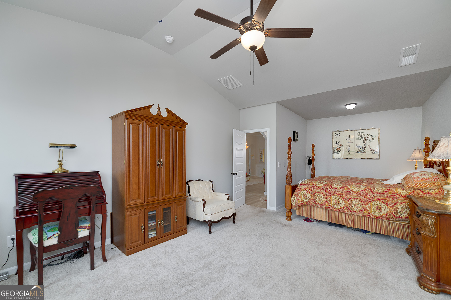 1517 Stinson Lane, Unit PHASE Locust Grove, GA 30248 - Photo 28 of 46 a bedroom with a bed and a chandelier