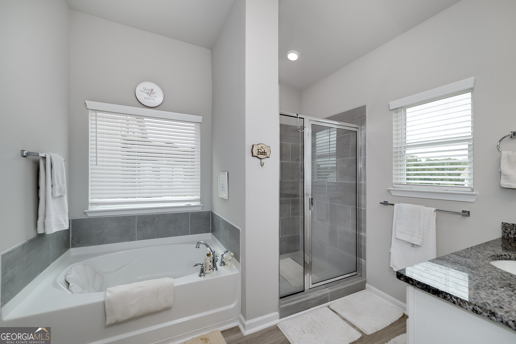 1517 Stinson Lane, Unit PHASE Locust Grove, GA 30248 - Photo 31 of 46 a bathroom with a granite countertop tub shower and sink