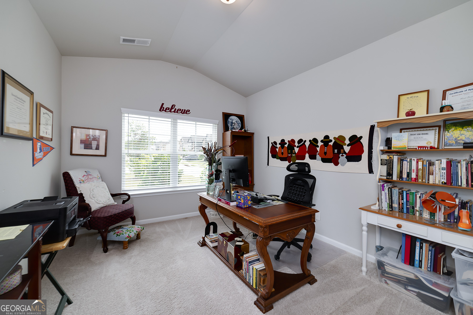1517 Stinson Lane, Unit PHASE Locust Grove, GA 30248 - Photo 33 of 46 a room with furniture and a book shelf