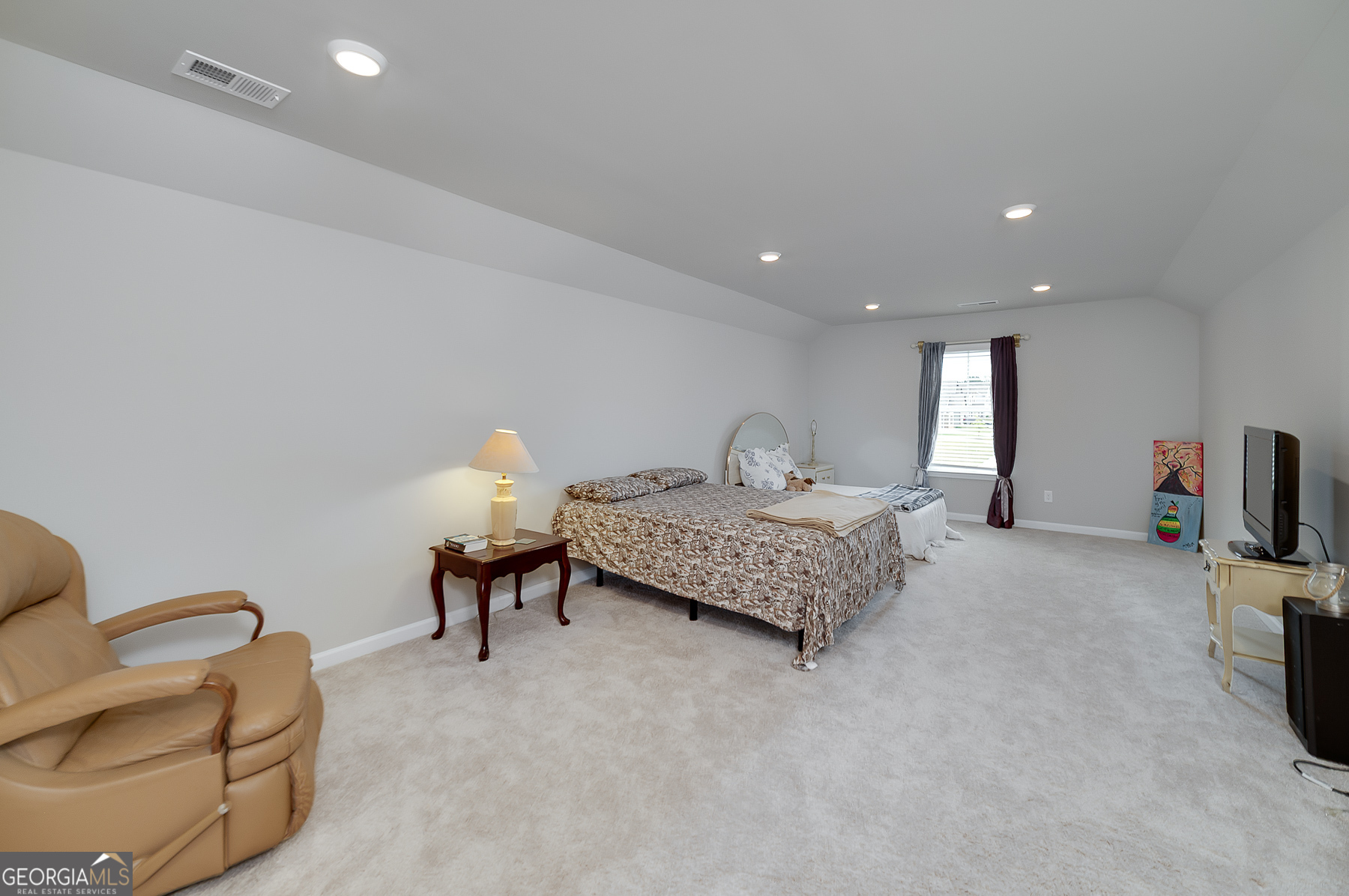 1517 Stinson Lane, Unit PHASE Locust Grove, GA 30248 - Photo 36 of 46 a bedroom with bed and a couch