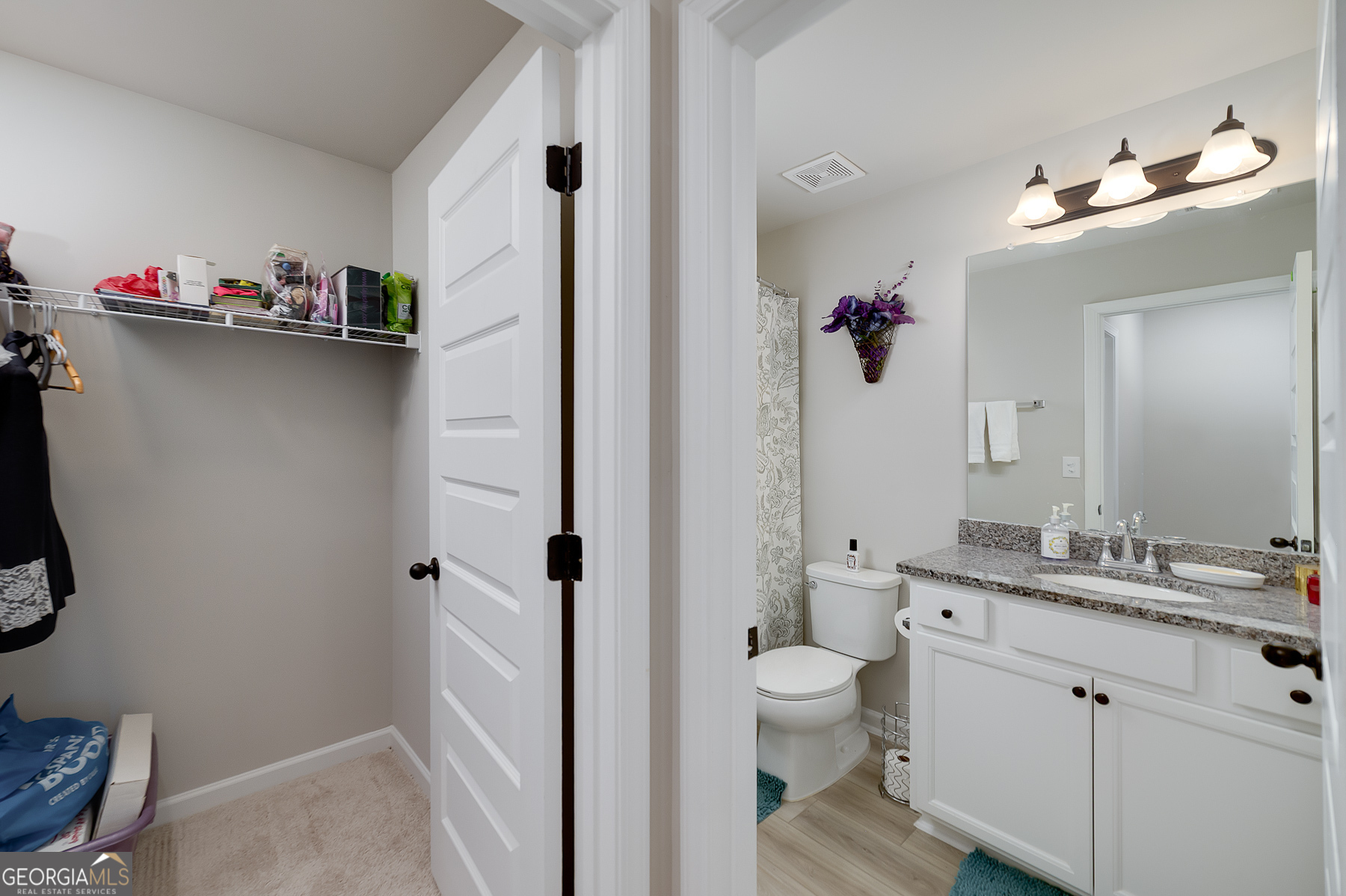 1517 Stinson Lane, Unit PHASE Locust Grove, GA 30248 - Photo 38 of 46 a bathroom with a sink vanity mirror and toilet