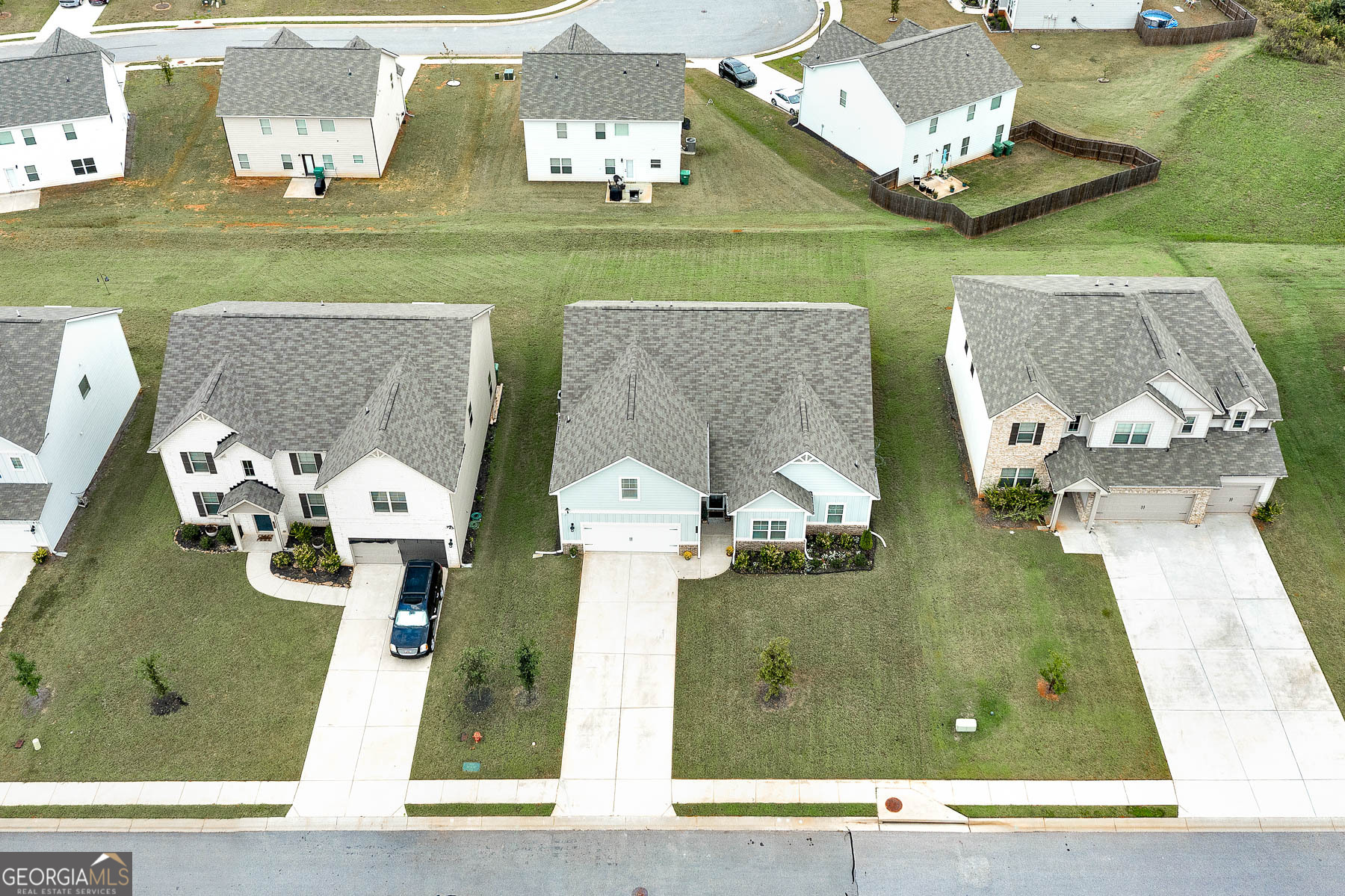 1517 Stinson Lane, Unit PHASE Locust Grove, GA 30248 - Photo 43 of 46 an aerial view of a house with a yard