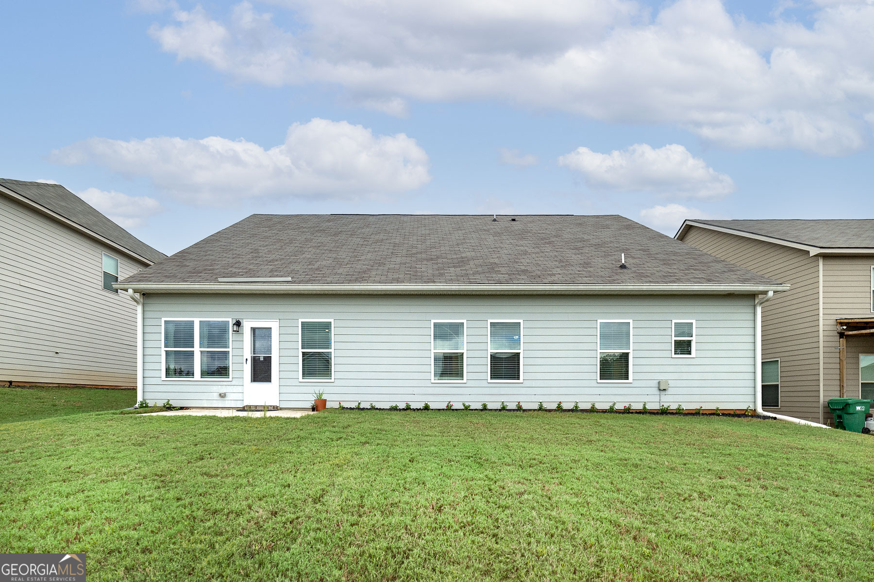 1517 Stinson Lane, Unit PHASE Locust Grove, GA 30248 - Photo 5 of 46 a view of a house with a backyard