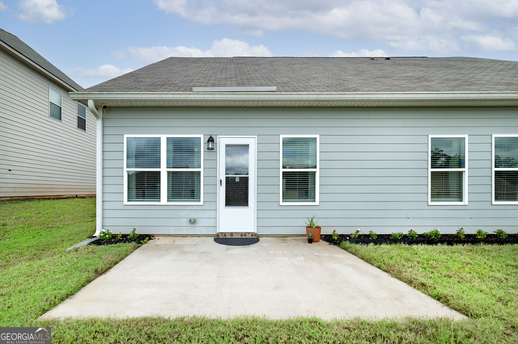 1517 Stinson Lane, Unit PHASE Locust Grove, GA 30248 - Photo 7 of 46 a front view of a house with a yard