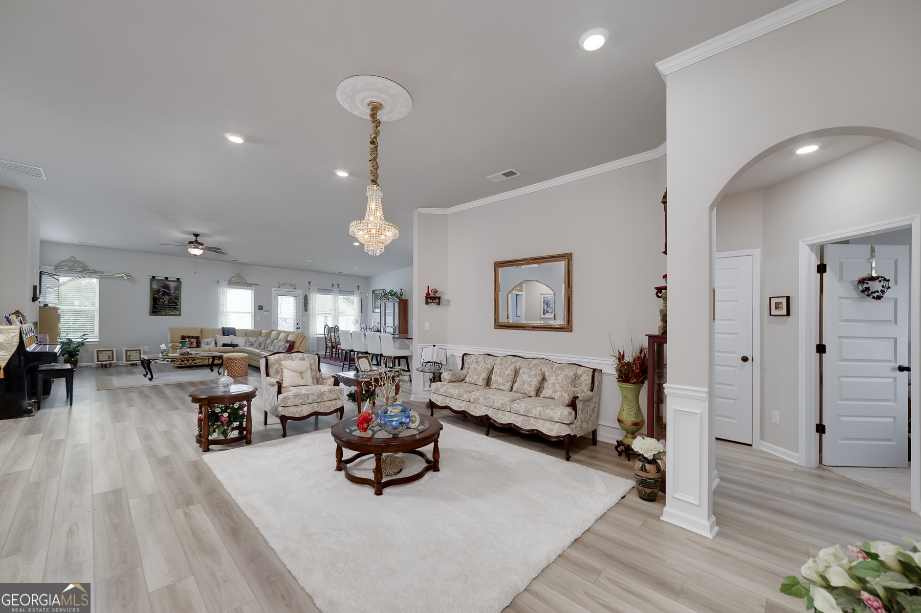 1517 Stinson Lane, Unit PHASE Locust Grove, GA 30248 - Photo 10 of 46 a living room with furniture and wooden floor