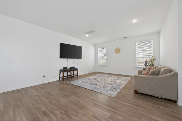 a bed room with a bed and a window