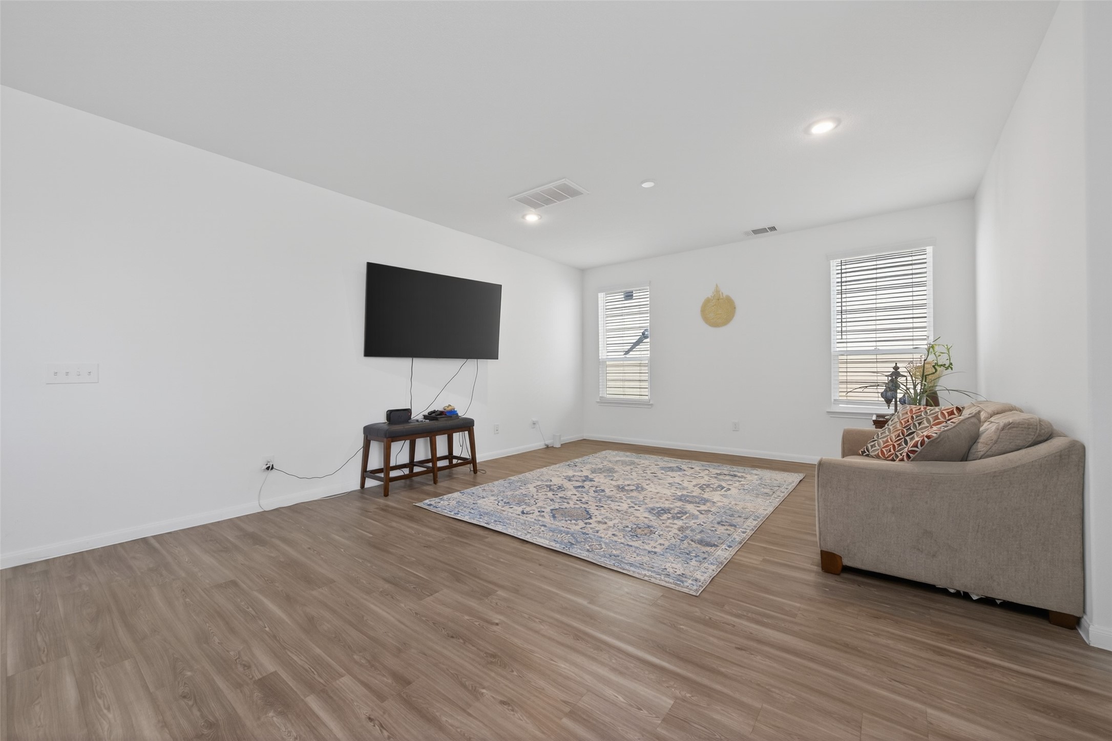 7326 Madison Cmns Lane Houston, TX 77075 - Photo 8 of 45 Vinyl flooring throughout the living area.