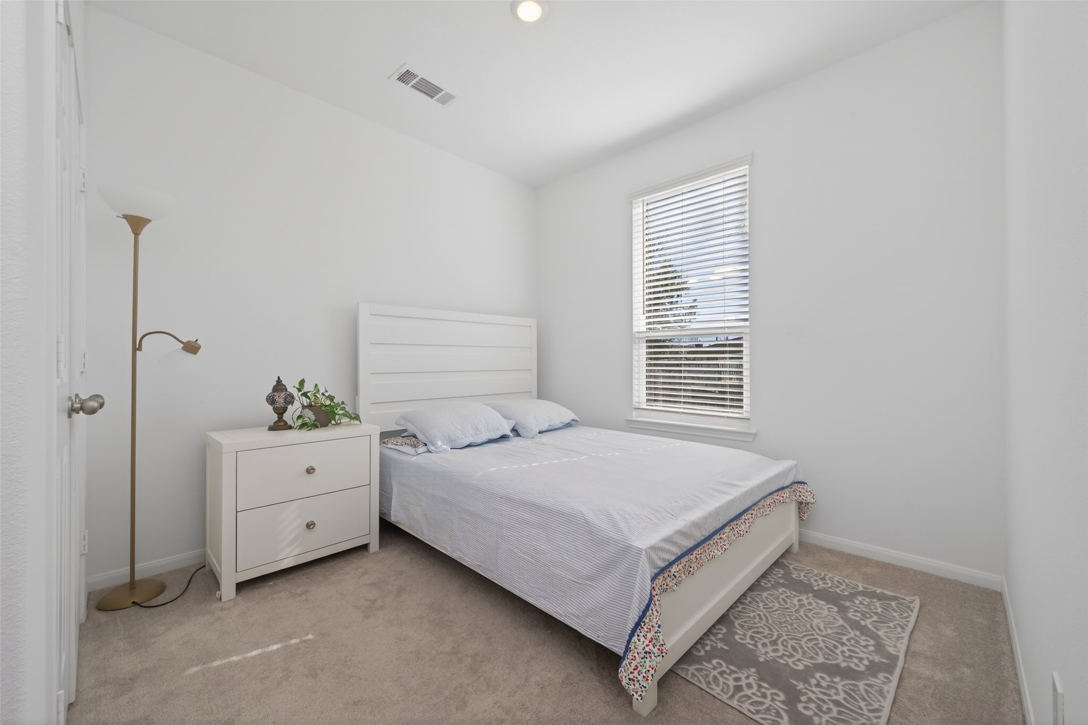 7326 Madison Cmns Lane Houston, TX 77075 - Photo 9 of 45 Bedroom on first floor right next to the living area.