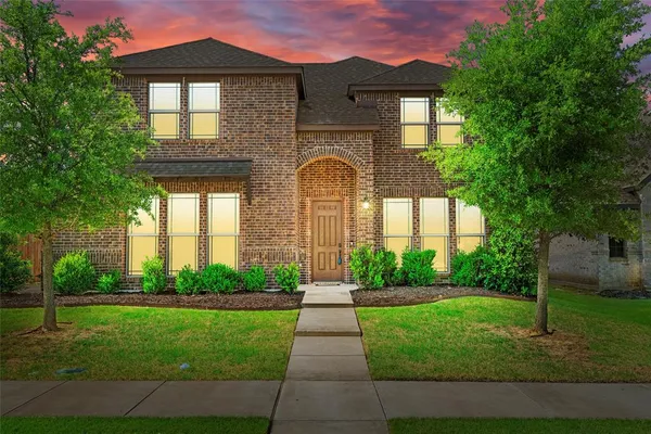 a front view of a house with yard