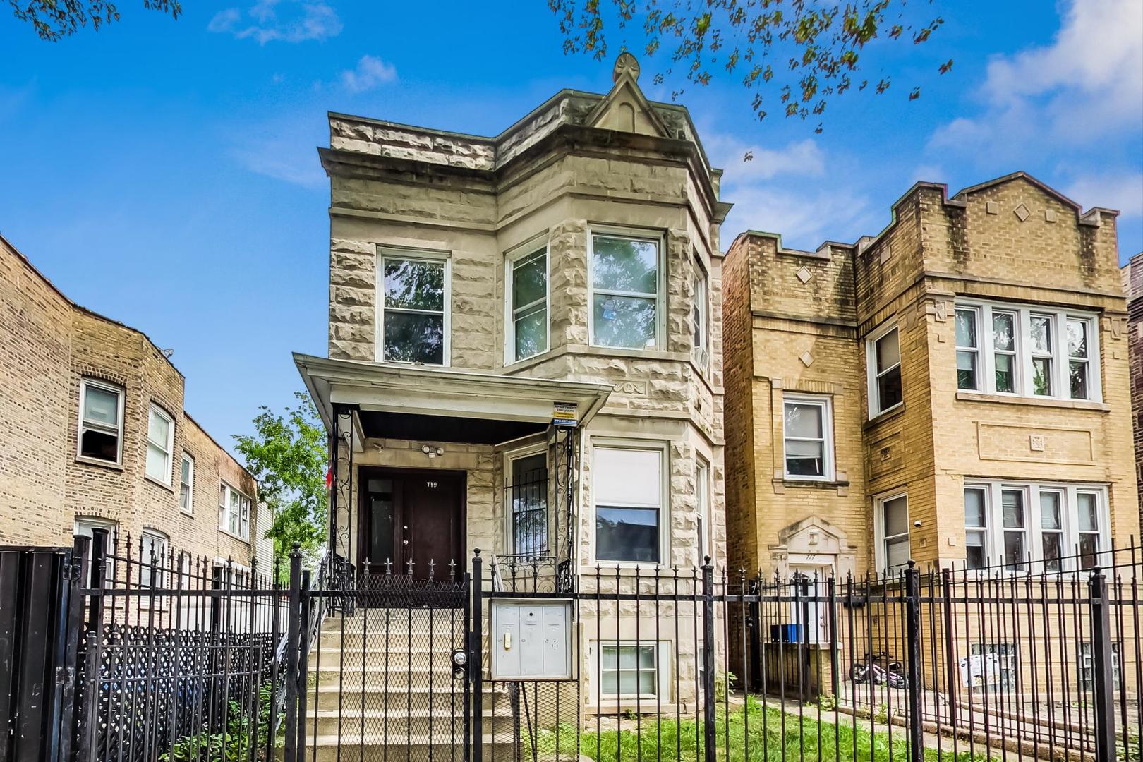 719 North Ridgeway Avenue Chicago, IL 60624 - Photo 2 of 58 front view of a brick house with a small yard