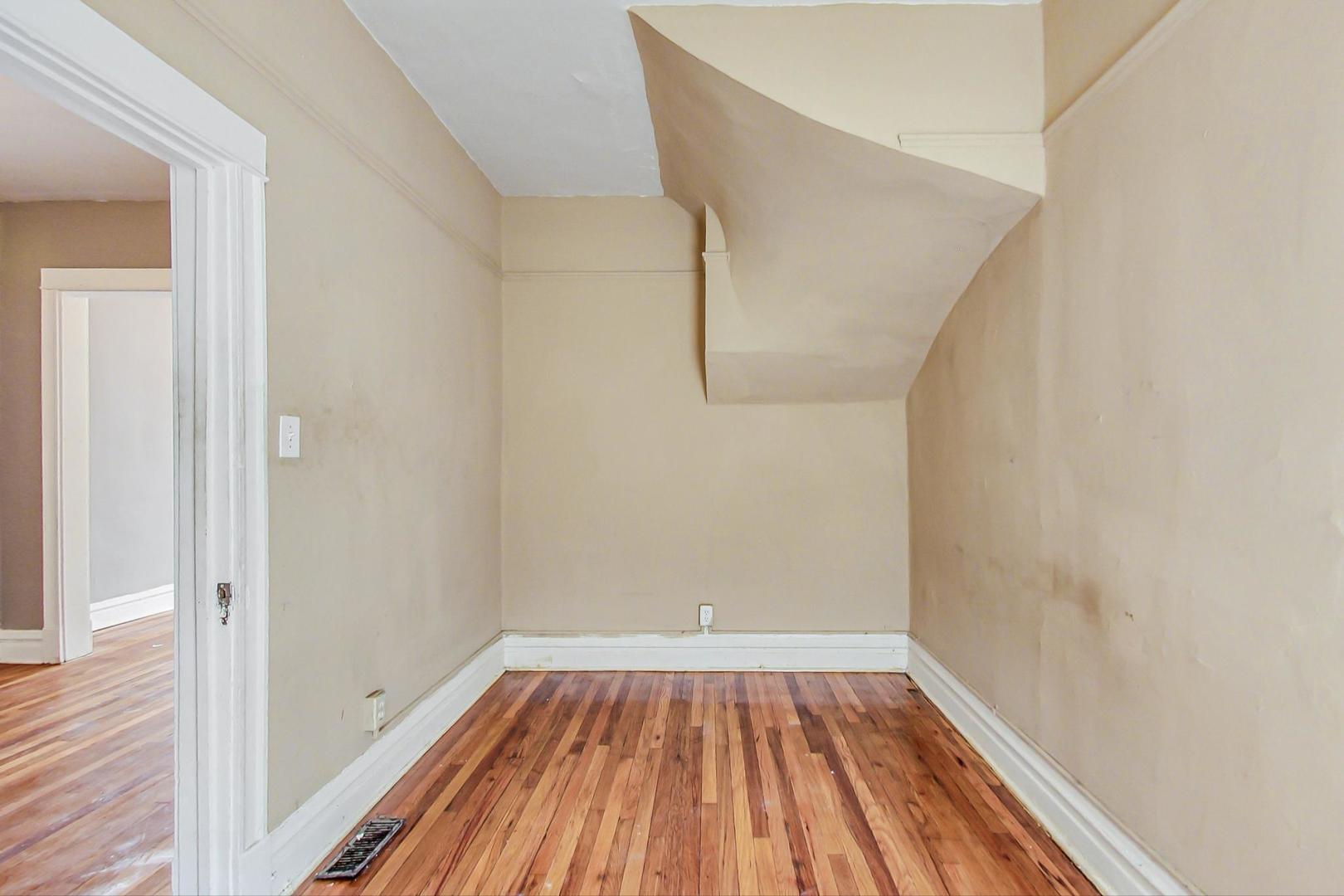 719 North Ridgeway Avenue Chicago, IL 60624 - Photo 22 of 58 a view of a room with wooden floor and bench