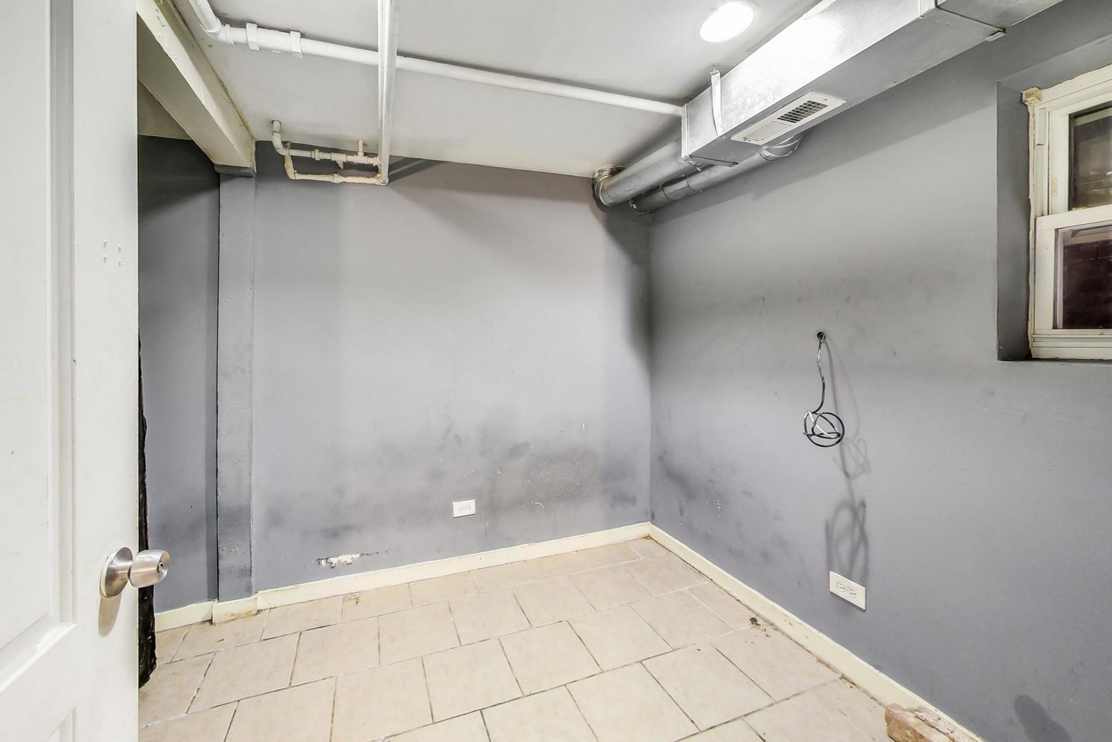 719 North Ridgeway Avenue Chicago, IL 60624 - Photo 33 of 58 a view of a room with racks on the wall