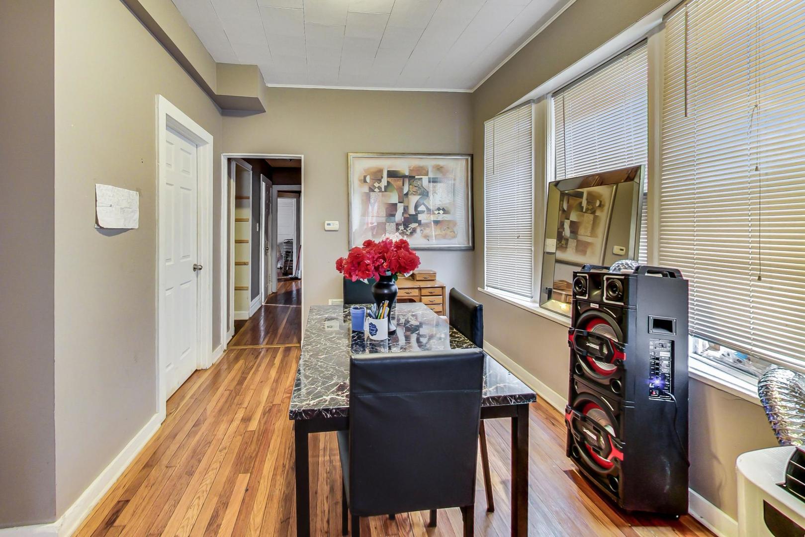 719 North Ridgeway Avenue Chicago, IL 60624 - Photo 38 of 58 a view of a dining room with furniture and wooden floor