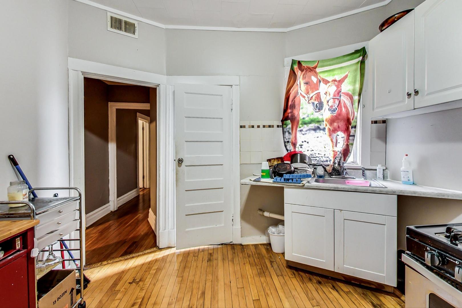 719 North Ridgeway Avenue Chicago, IL 60624 - Photo 43 of 58 a kitchen with a sink and cabinets