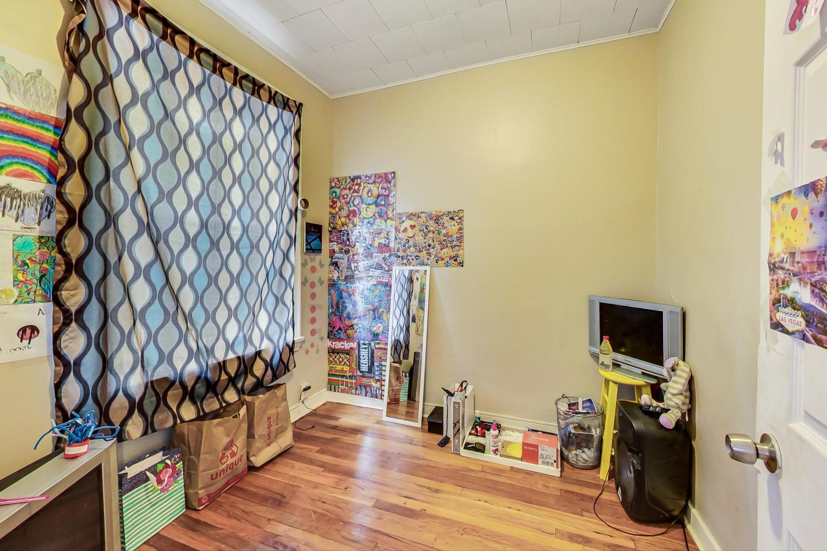 719 North Ridgeway Avenue Chicago, IL 60624 - Photo 52 of 58 a view of a room with toys and wooden floor