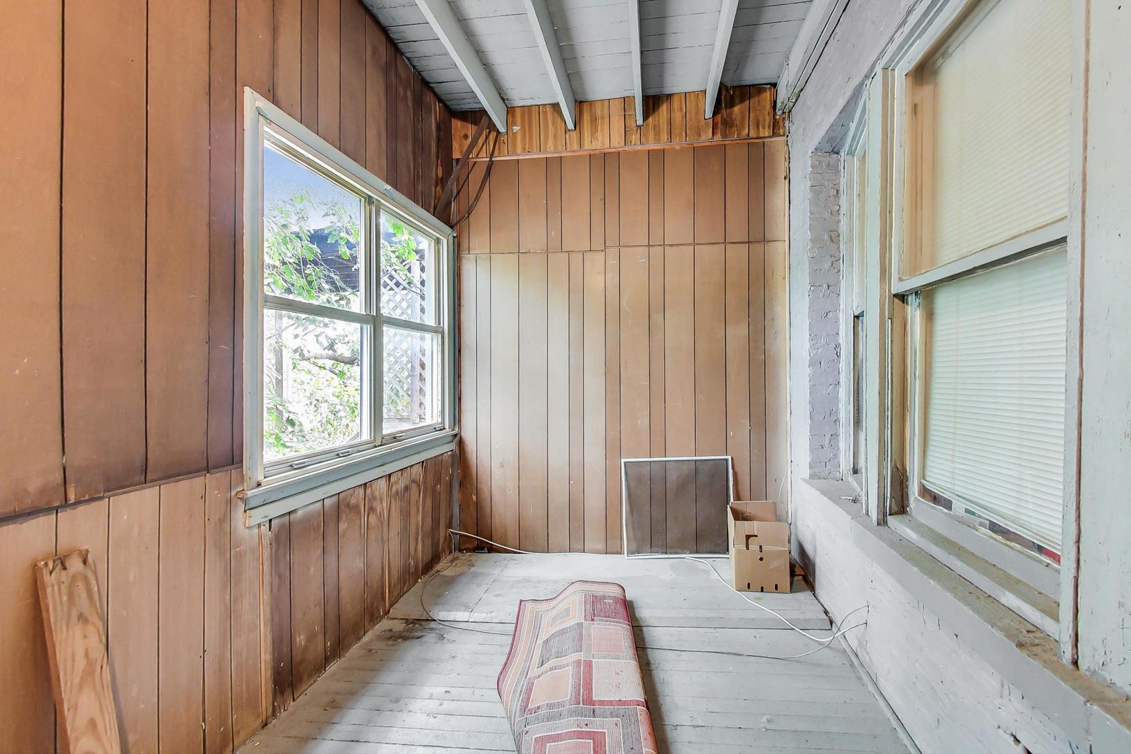 719 North Ridgeway Avenue Chicago, IL 60624 - Photo 55 of 58 a spacious bedroom with a large bed and a large window
