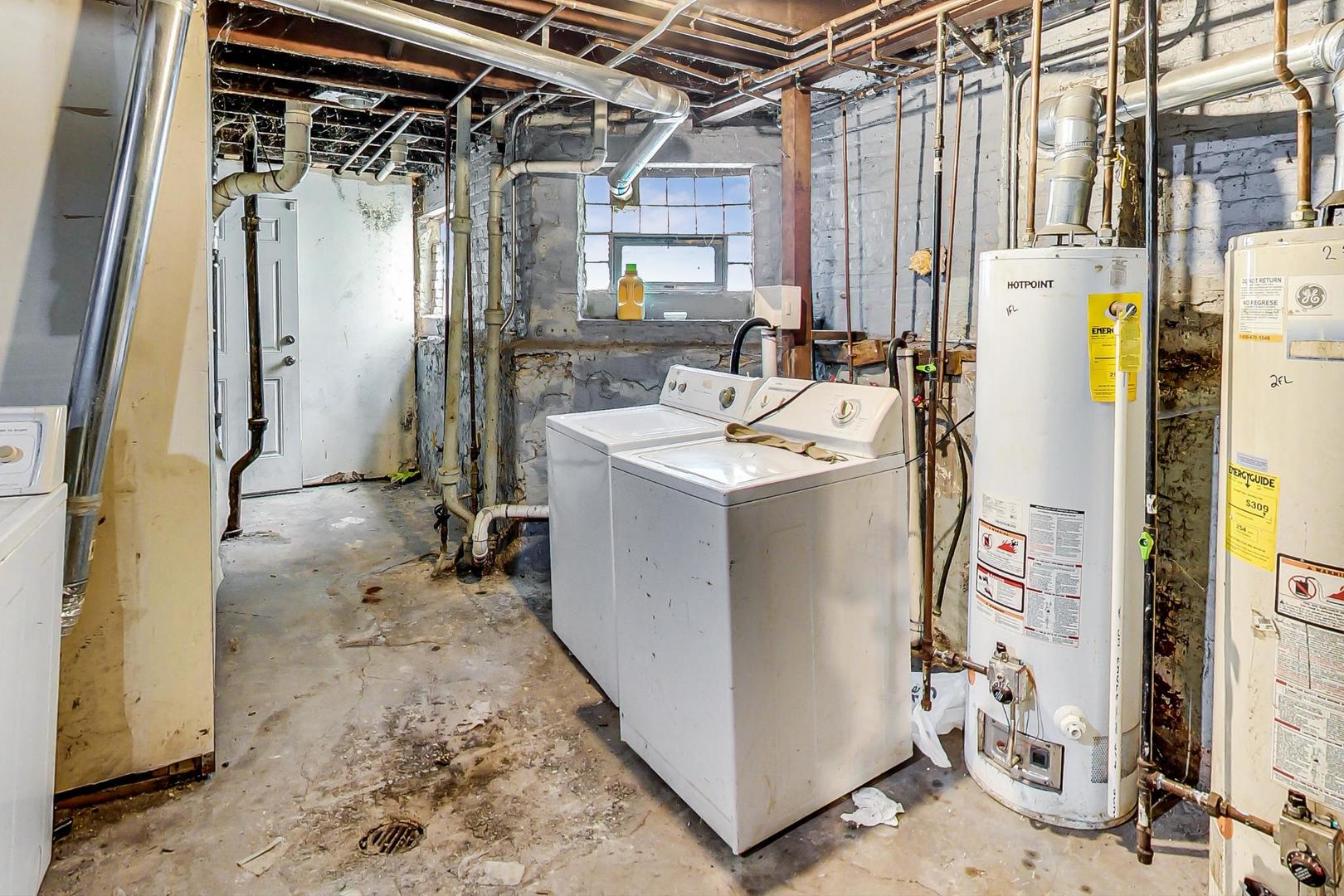 719 North Ridgeway Avenue Chicago, IL 60624 - Photo 57 of 58 a utility room with dryer and washer