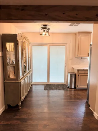 a kitchen with sink refrigerator and microwave