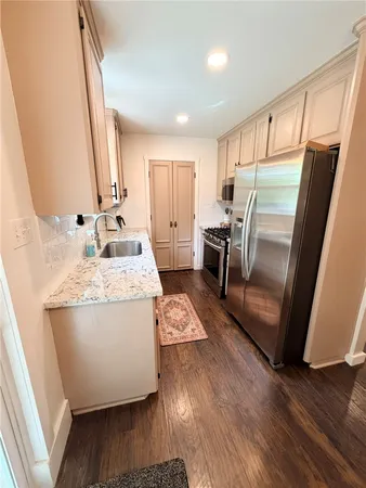 a kitchen with appliances and cabinets